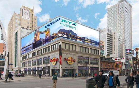 The screen above the Hard Rock Cafe at Dundas Square, Toronto