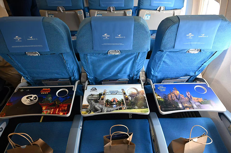 Advertisement for a small table in the cabin of an Eastern Airlines aircraft