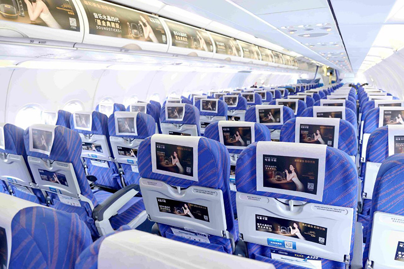 Advertisement for headrest scarves in the cabin of Shenzhen Airlines aircraft