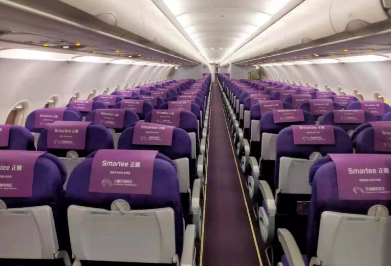 Juneyao Airlines aircraft cabin small table advertisement